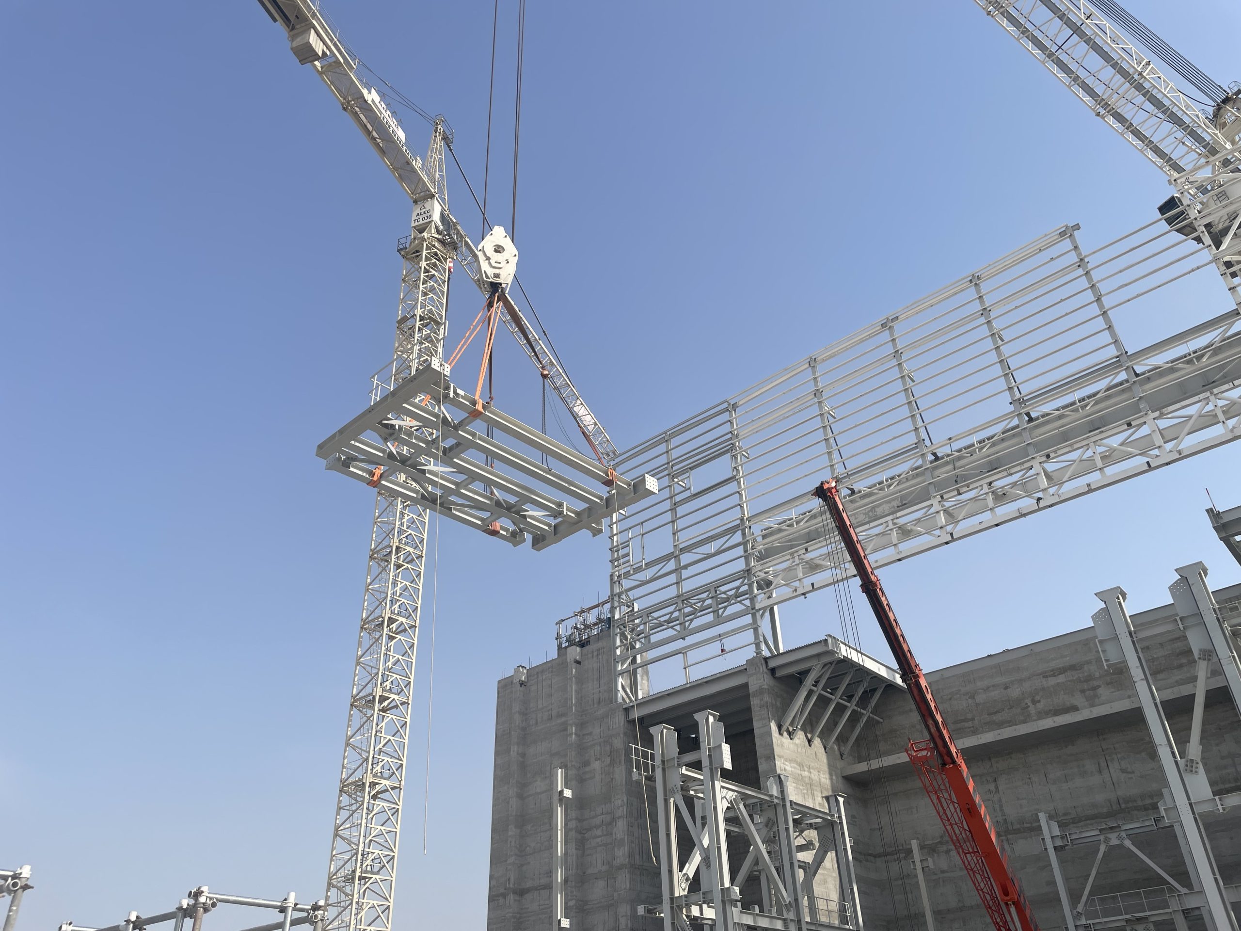 A composite steel structure is lifted into position